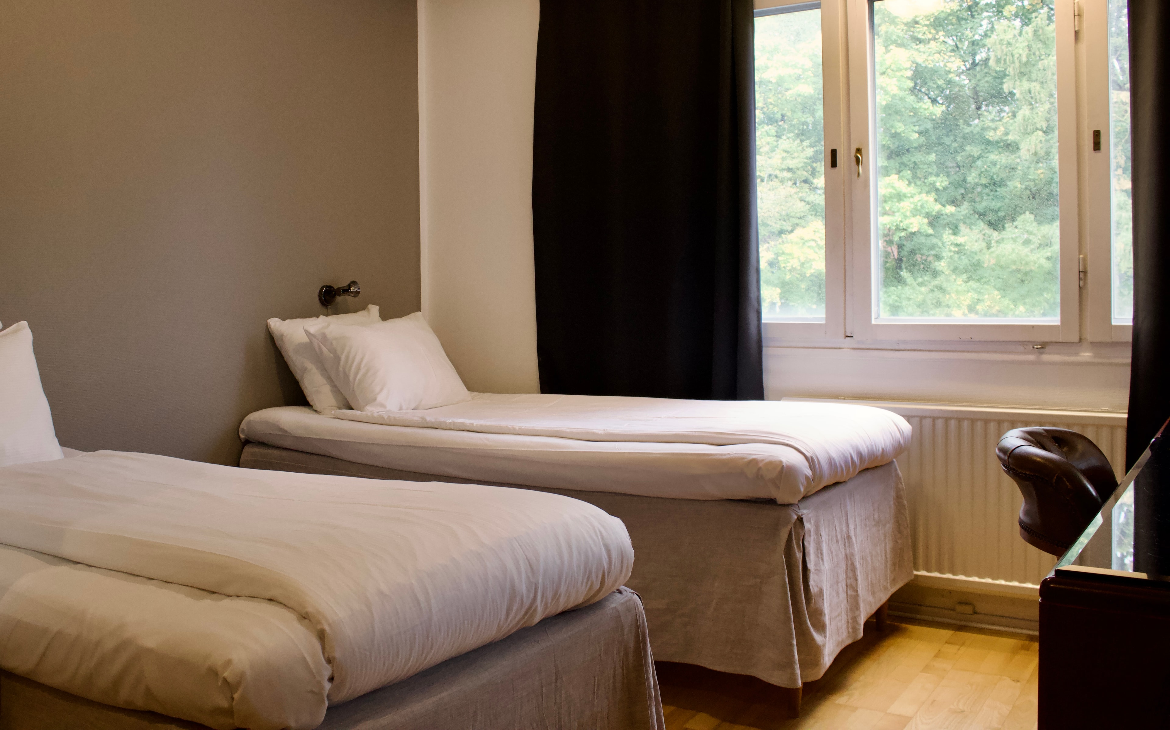 Twin room with garden view at Place Lund Hotel